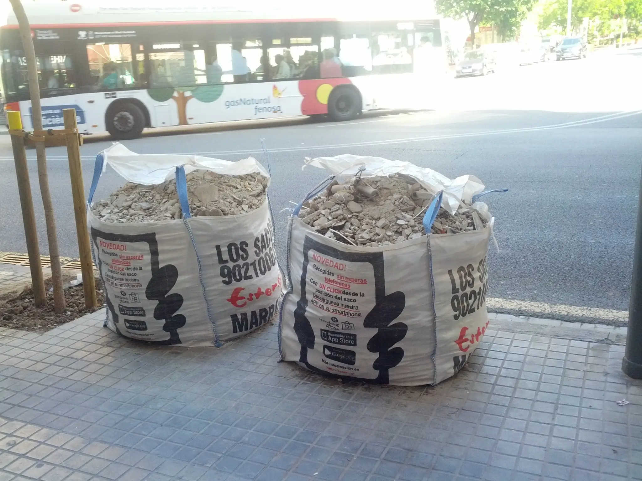 Large bags of construction debris awaiting collection. As concrete and other rubble is very dense, it can quickly increase junk removal costs in Delaware.