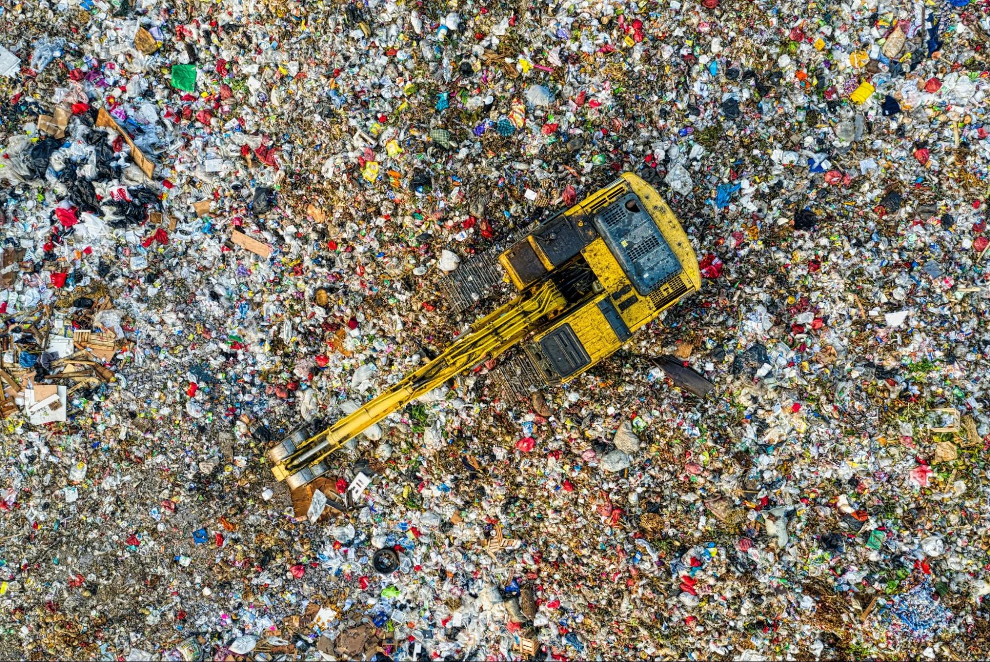 An image showing an aerial view of a landfill site.  